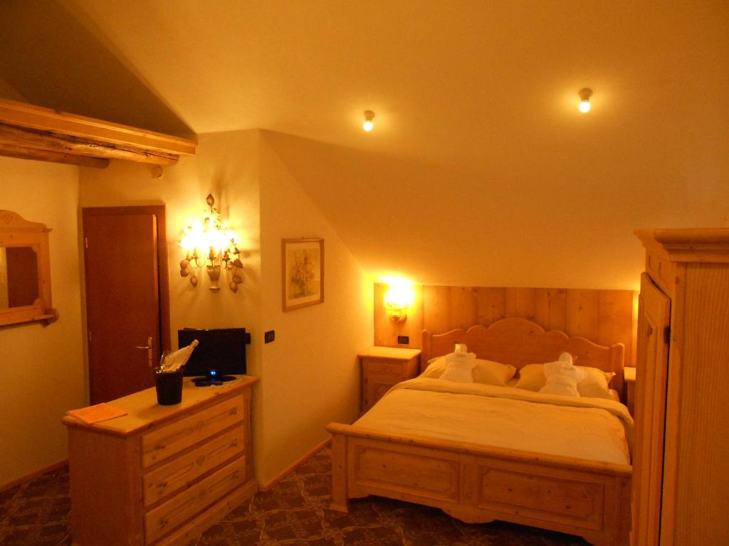 Postel nebo postele na pokoji v ubytování Hotel Relais Grünwald