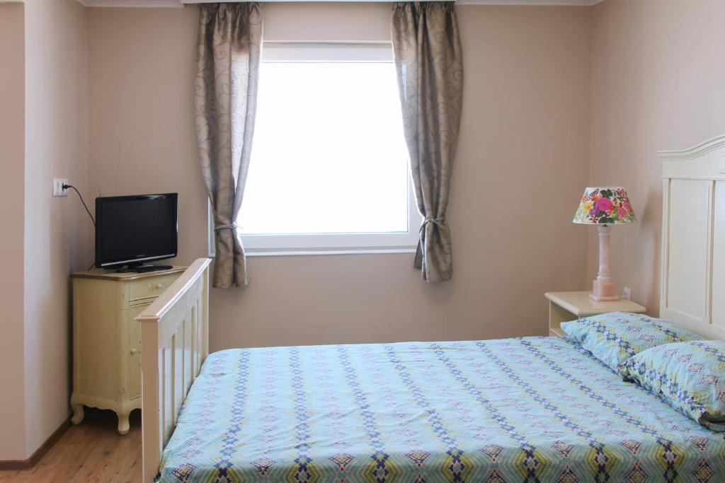 Ένα ή περισσότερα κρεβάτια σε δωμάτιο στο Beach Apartment MELINA