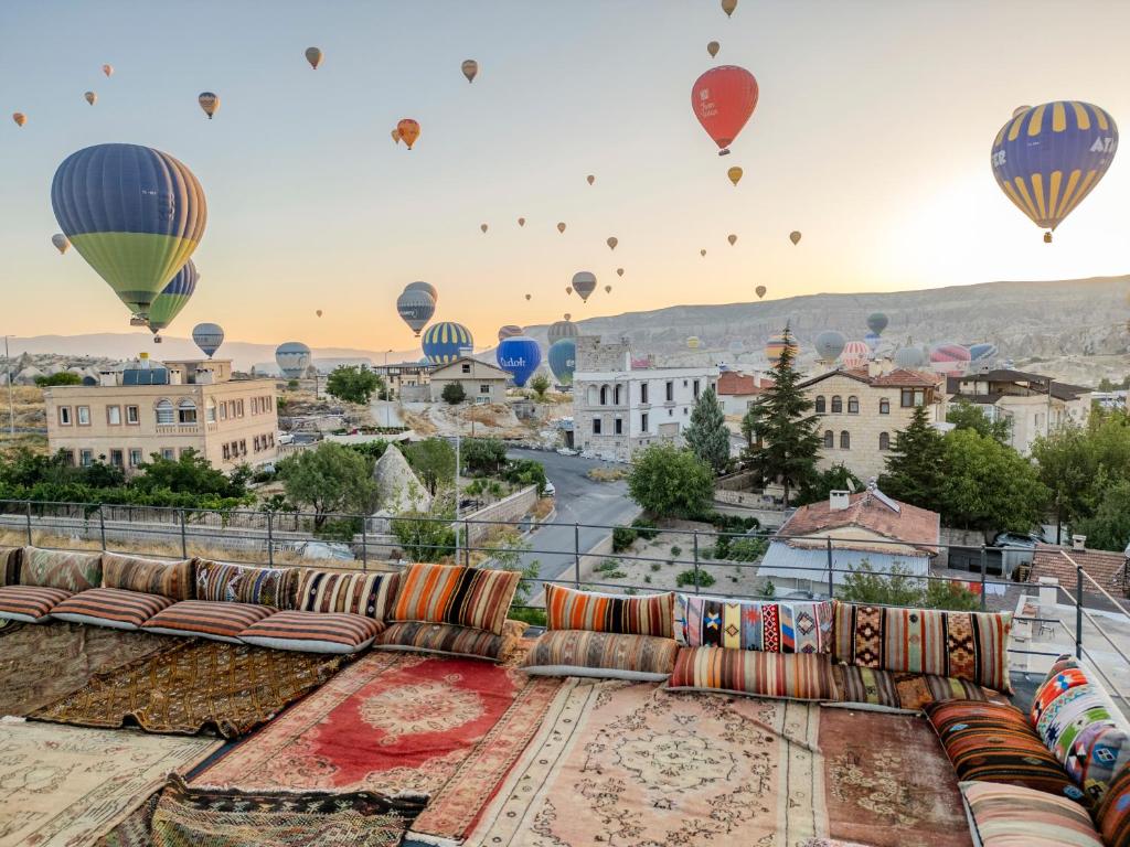 a view of a city with hot air balloons at Latona Stone Palace in Göreme