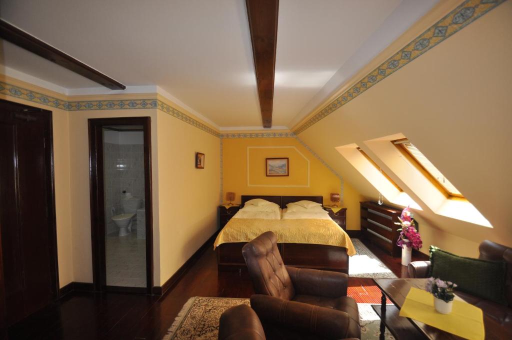 Postel nebo postele na pokoji v ubytování GARNI -Hotel Barbakan