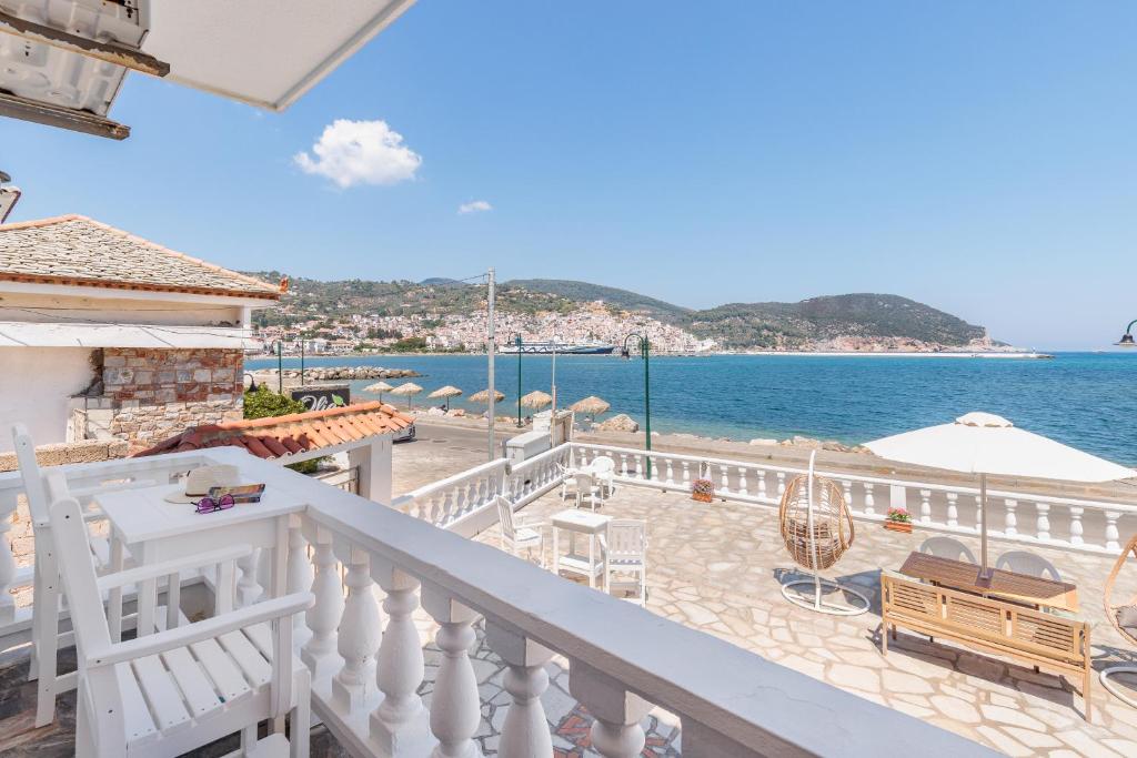 a balcony of a house with a view of the ocean at Villa Apostolis Studios in Skopelos Town