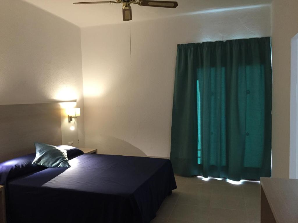 Кровать или кровати в номере Hotel Antares