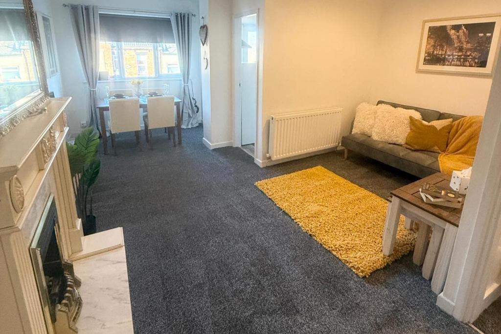 a living room with a couch and a table at 1 Bed Flat - Sleeps 3 - Parking - Pet friendly in South Shields
