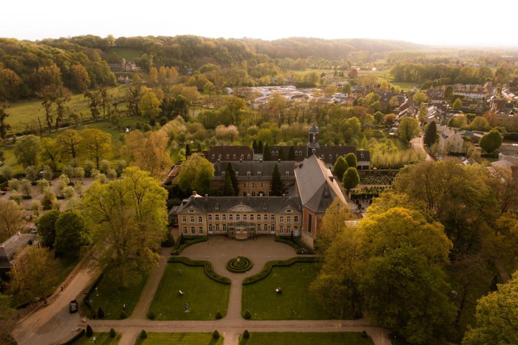 an aerial view of a large building with a park at Corneli Residences - Château St Gerlach in Valkenburg