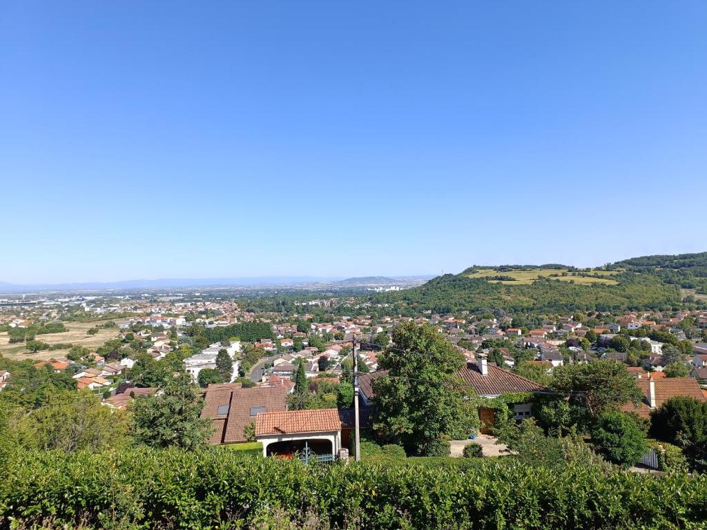 a view of a town from the top of a hill at Appartement avec vue exceptionnelle in Blanzat