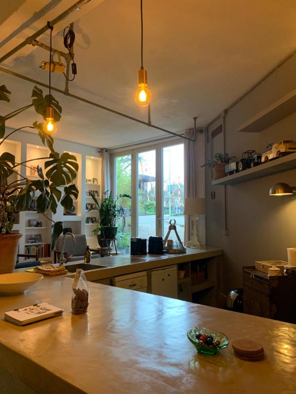 a kitchen with a wooden counter top in a room at B&B Loft 57 in Amsterdam