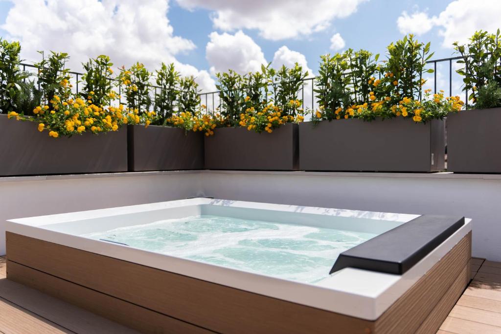 a hot tub on the roof of a house at Casa Tre Archi - Camere Luxury in Altamura