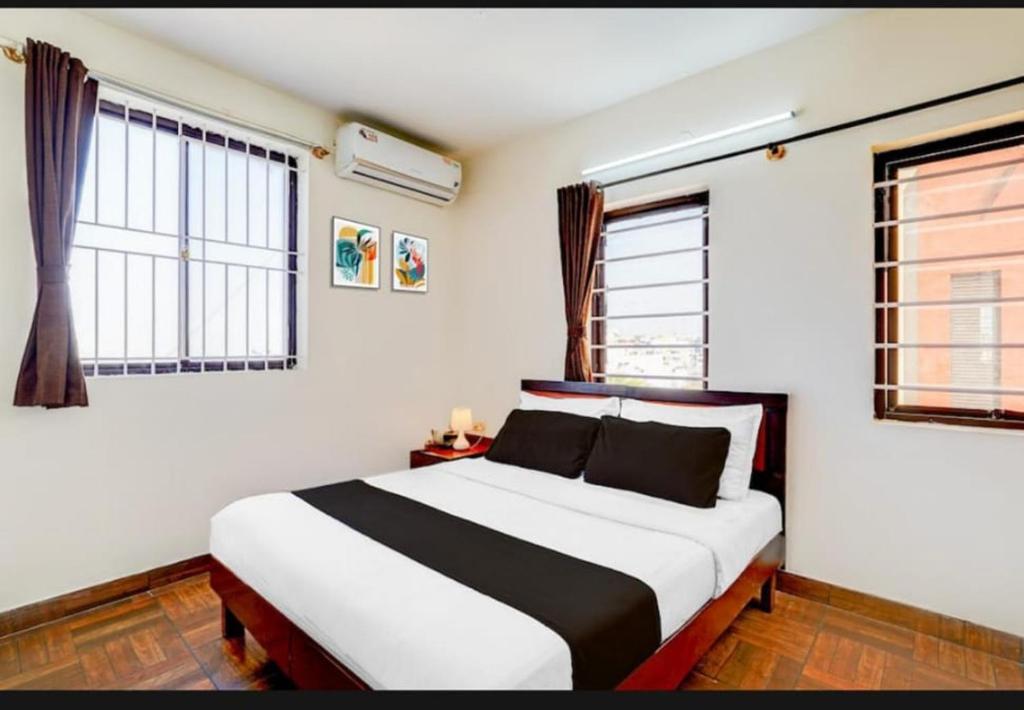 Ένα ή περισσότερα κρεβάτια σε δωμάτιο στο Applepie Residency