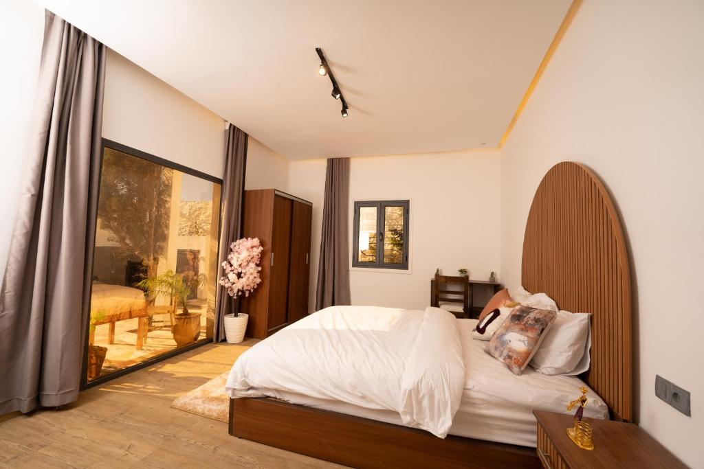 En eller flere senge i et værelse på Villa Nour Mogador