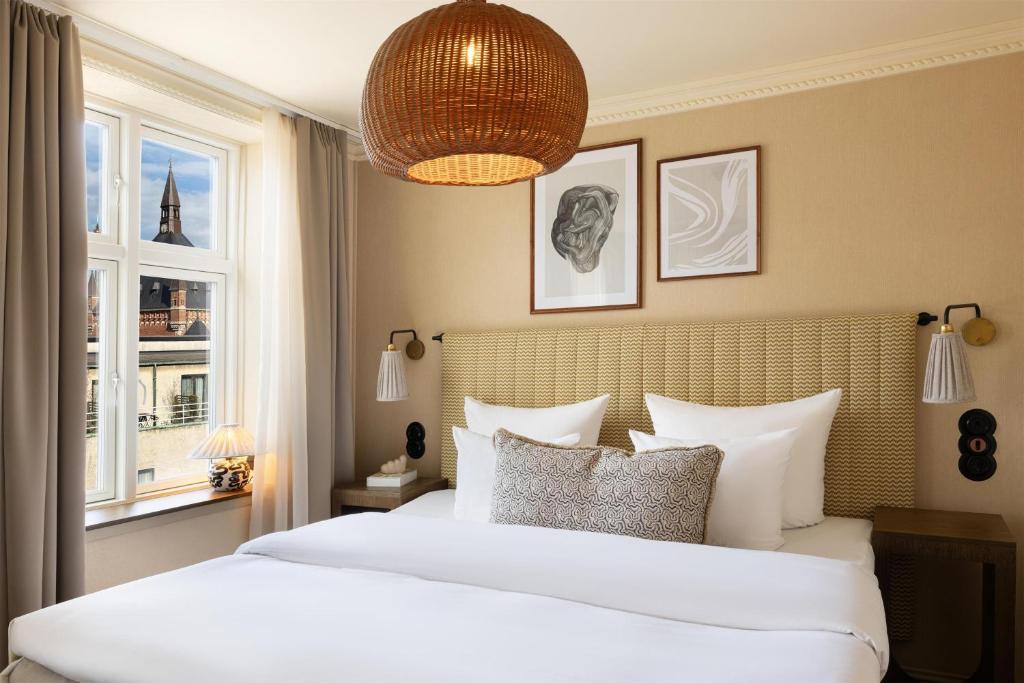 En eller flere senge i et værelse på NH Copenhagen Grand Joanne