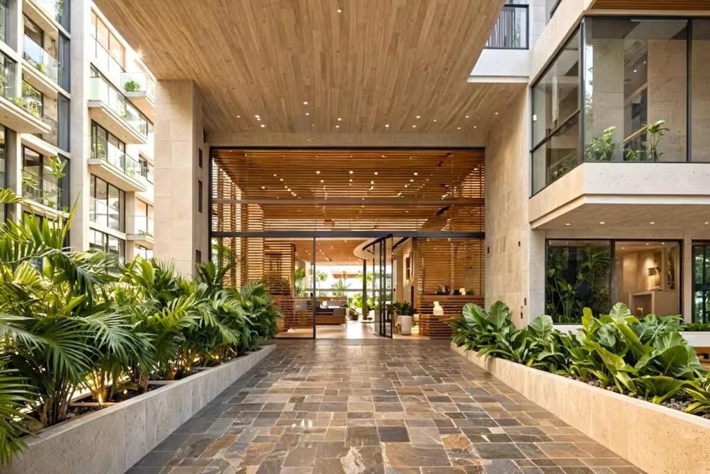an internal courtyard of a building with plants at Luxury vacation apartment, sea salt flats in Playa Bello Horizonte