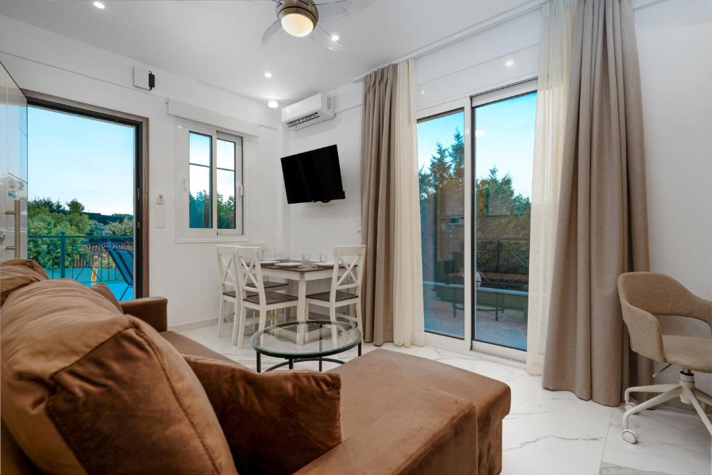 Μια τηλεόραση ή/και κέντρο ψυχαγωγίας στο Elia Apartment - Hellenic Apartments Avlona