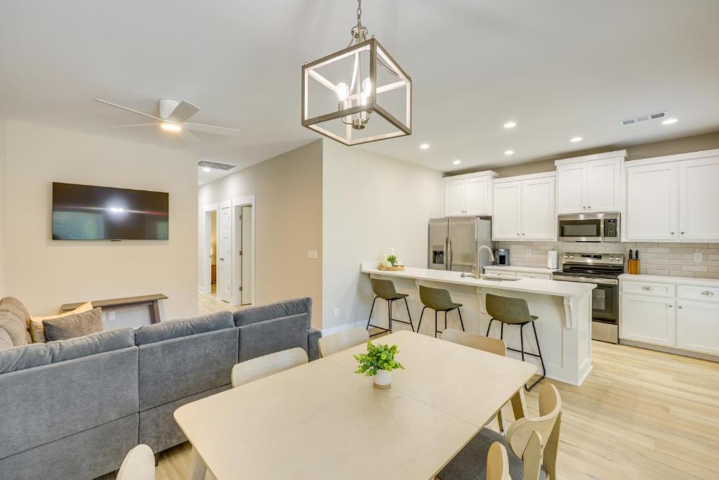 a living room with a couch and a table at Near 17 Springs Sports Complex Millbrook Duplex! in Millbrook