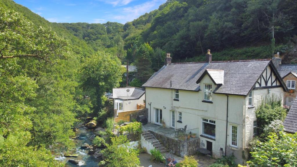 an aerial view of a house in the mountains at River Cottage in stunning location in Countisbury
