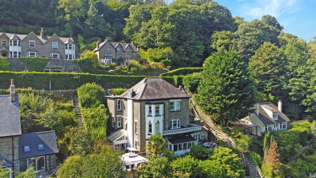 an aerial view of a house in a village at The Cottage at Woodlands in Lynton