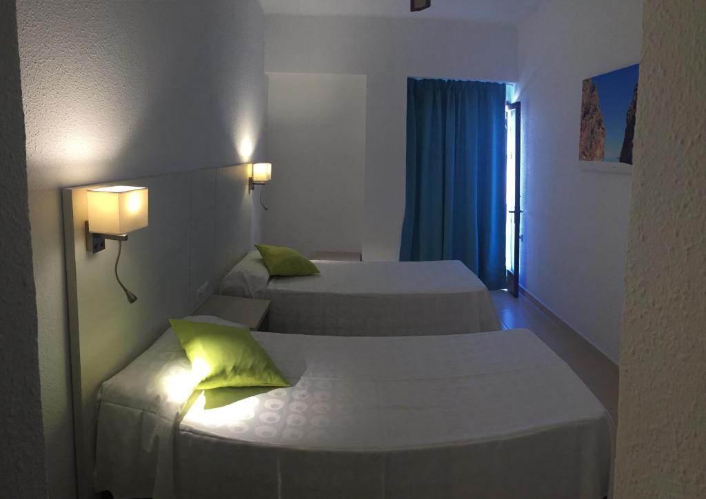 Кровать или кровати в номере Hotel Antares