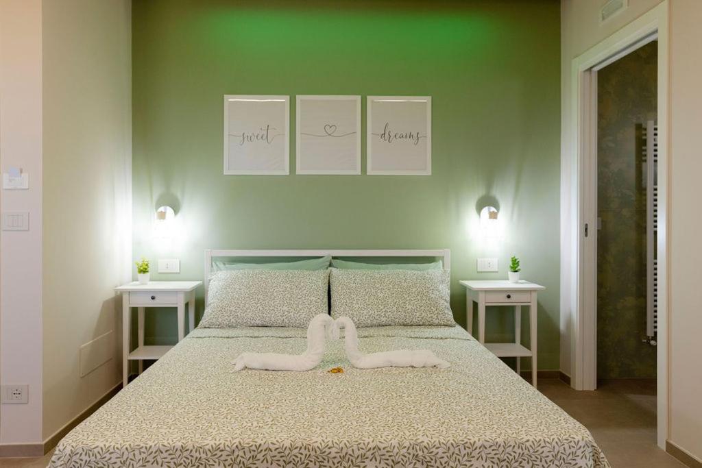a bedroom with a bed with two white towels on it at Il Panorama in Polistena