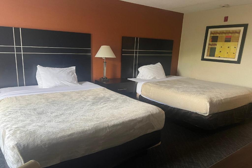 Ένα ή περισσότερα κρεβάτια σε δωμάτιο στο Hotel Inn Columbus