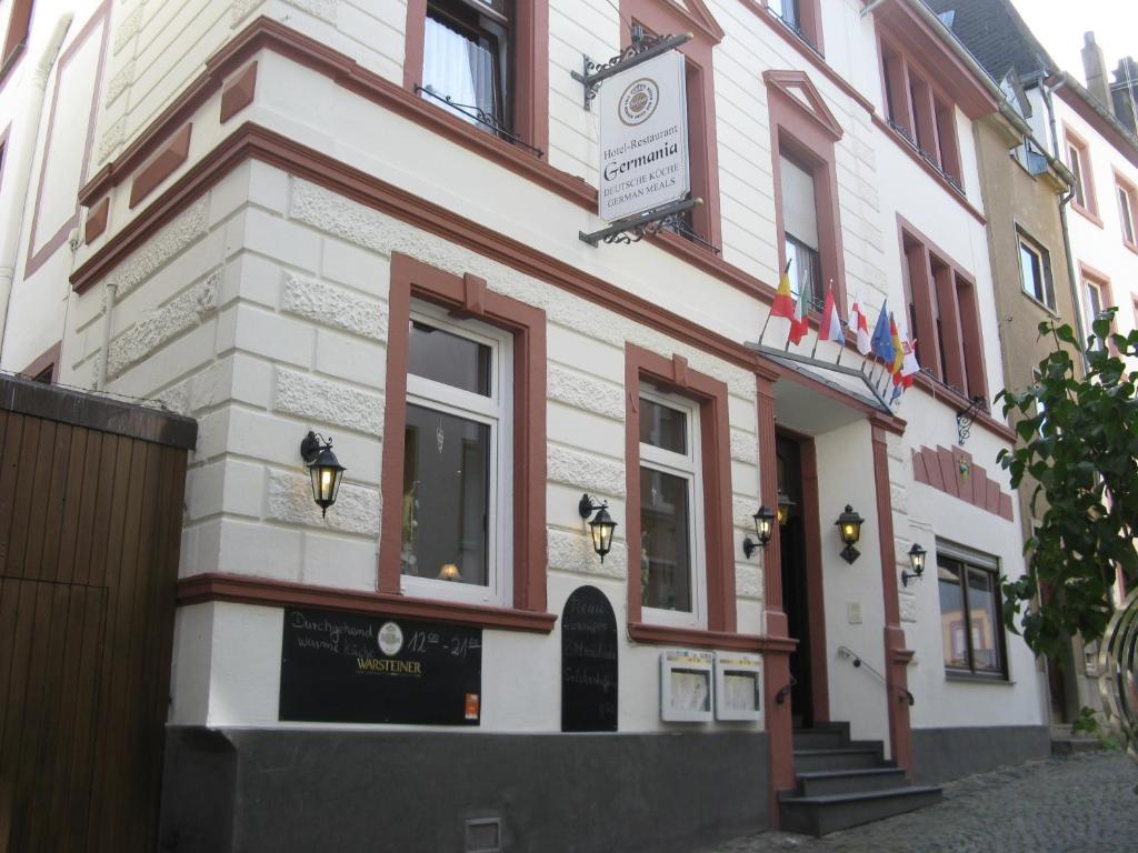 a building with a sign on the front of it at Hotel-Restaurant Kastel in Bernkastel-Kues