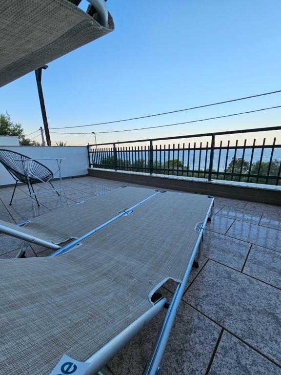 a tennis court on top of a roof at Alba di Mare - Appartamento con Vista Mare in Andrano