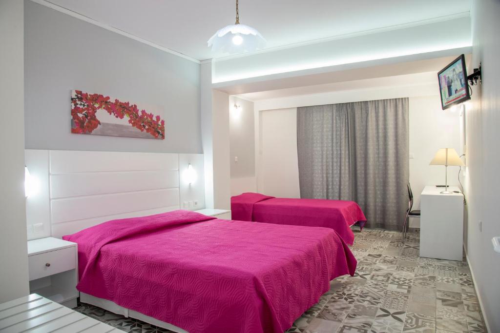 Postel nebo postele na pokoji v ubytování Byron Apartments
