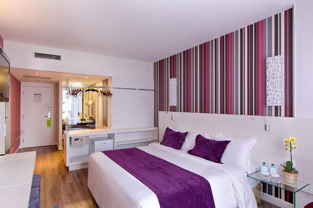 Postel nebo postele na pokoji v ubytování Radisson Hotel Curitiba