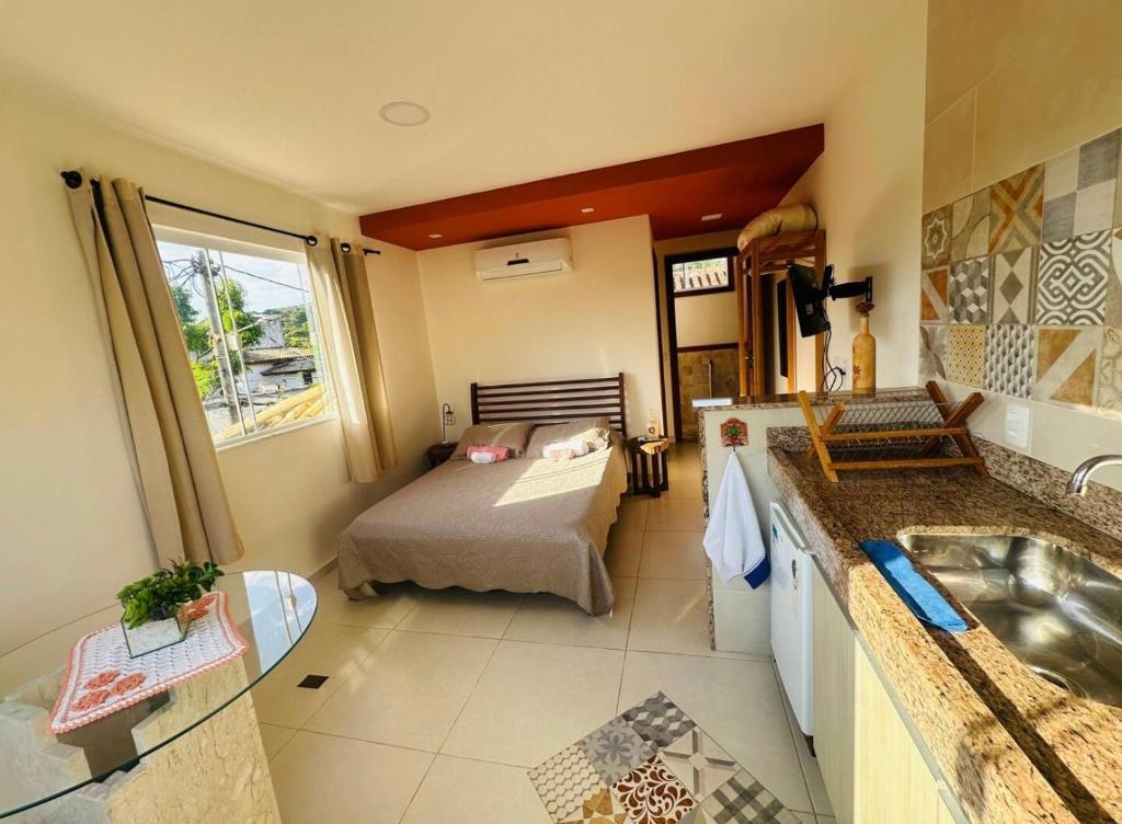 En eller flere senge i et værelse på Flat Buziano