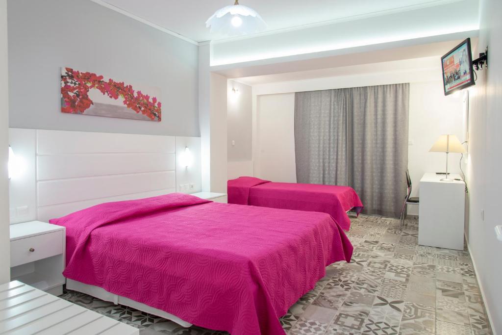 Postel nebo postele na pokoji v ubytování Byron Apartments