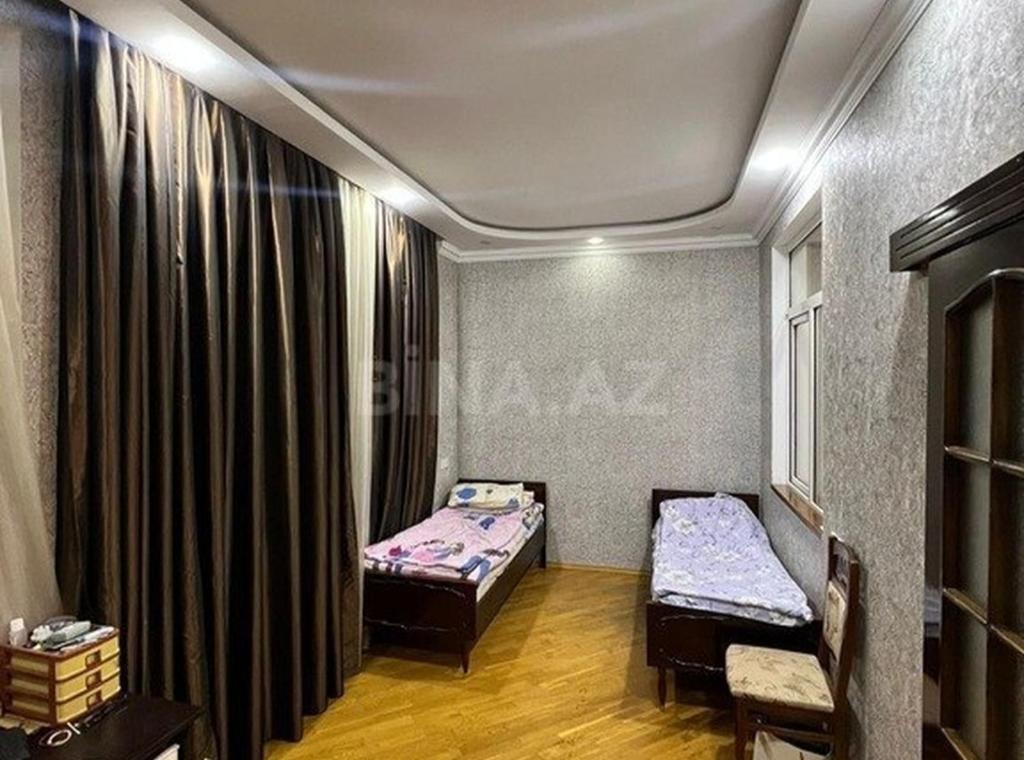 Ένα ή περισσότερα κρεβάτια σε δωμάτιο στο Ronni Hotel