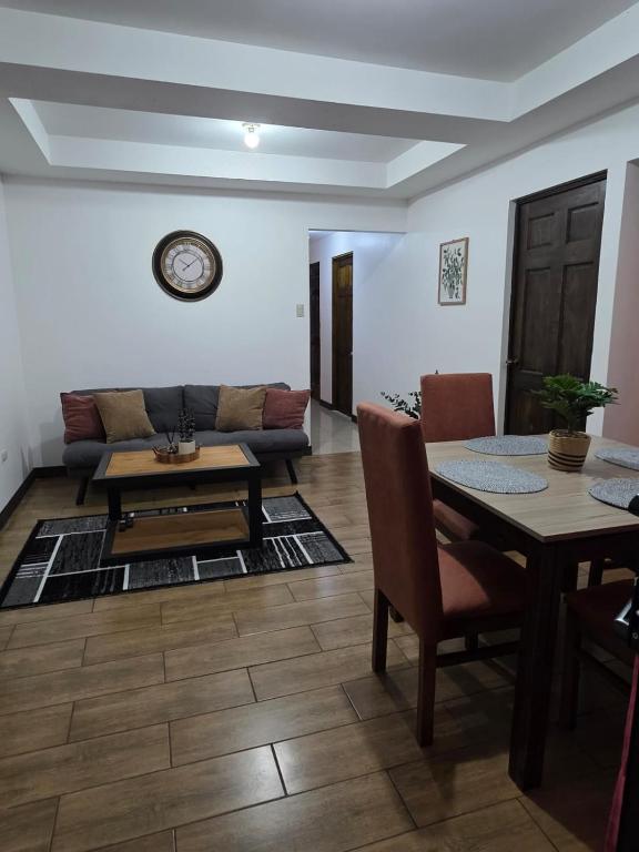 a living room with a table and a couch at Copey Inspira in El Copey