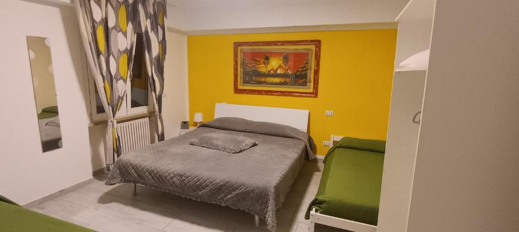 Ένα ή περισσότερα κρεβάτια σε δωμάτιο στο Casa Mia