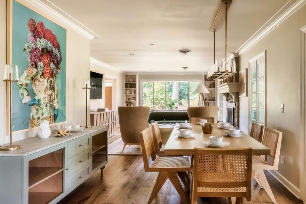 a dining room with a table and chairs at The Howell House - Picturesque Countryside Retreat in Starkville