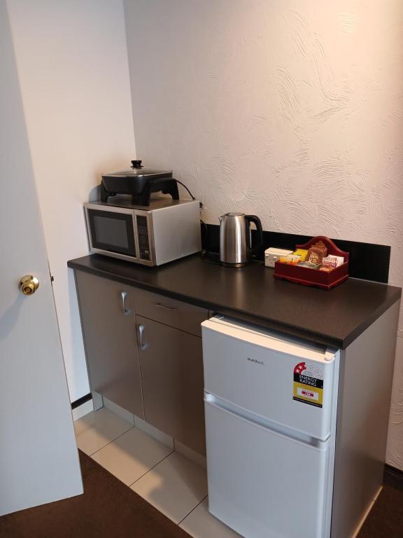 Palm City Motor Inn - Resim 7