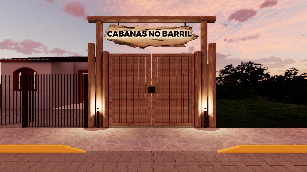 a gate with a sign that reads casablanca no barrier at Cabanas Farol in Pântano Grande