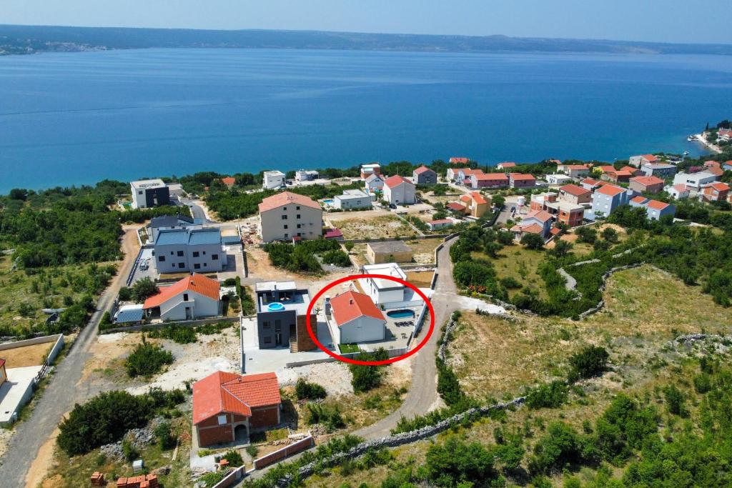 an aerial view of a house with a red roof at Family friendly house with a swimming pool Maslenica, Novigrad - 23719 in Jasenice