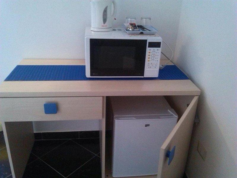 Kuchyň nebo kuchyňský kout v ubytování Affittacamere Sardegna Sole e Mare