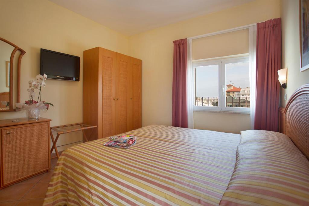 Posteľ alebo postele v izbe v ubytovaní Hotel Katy