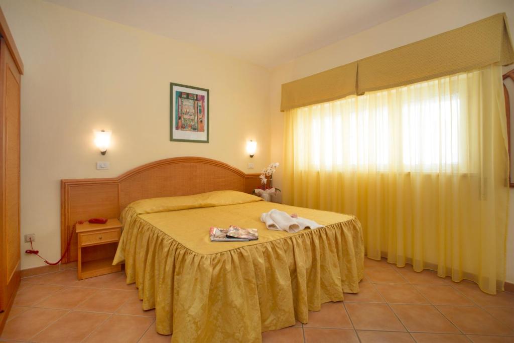 Posteľ alebo postele v izbe v ubytovaní Hotel Katy