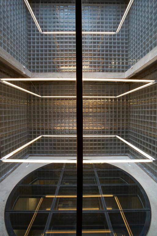 an empty walkway with lights in a building at Fordson Hotel, in the Unbound Collection by Hyatt in Oklahoma City