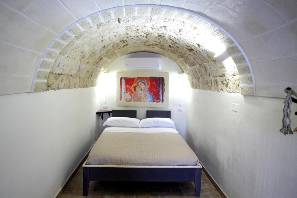 Postel nebo postele na pokoji v ubytování La Pergola ai Sassi
