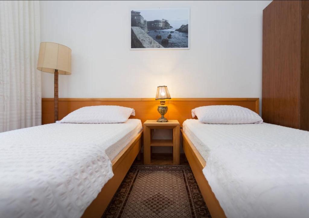 Posteľ alebo postele v izbe v ubytovaní Apartment and Rooms Villa Marijo