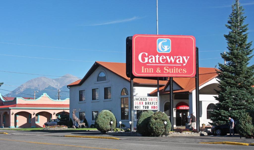 a sign for a car dealership in front of a building at Gateway Inn and Suites in Salida