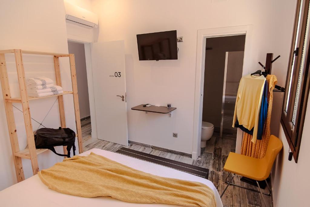 Posteľ alebo postele v izbe v ubytovaní The 8 Rooms House