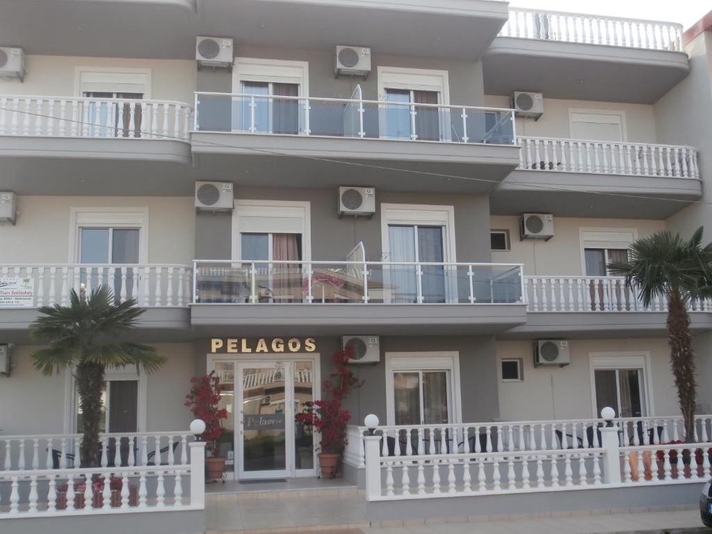 a building with a sign that reads palazzos at Villa Pelagos in Paralia Katerinis