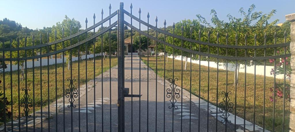 a gate to a garden with a pathway at Ktima Lazarata in Lazaráta