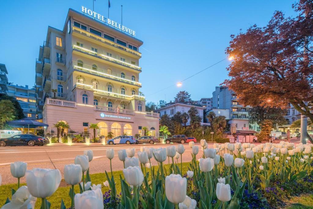a bunch of white tulips in front of a building at Best Western Hotel Bellevue au Lac in Lugano