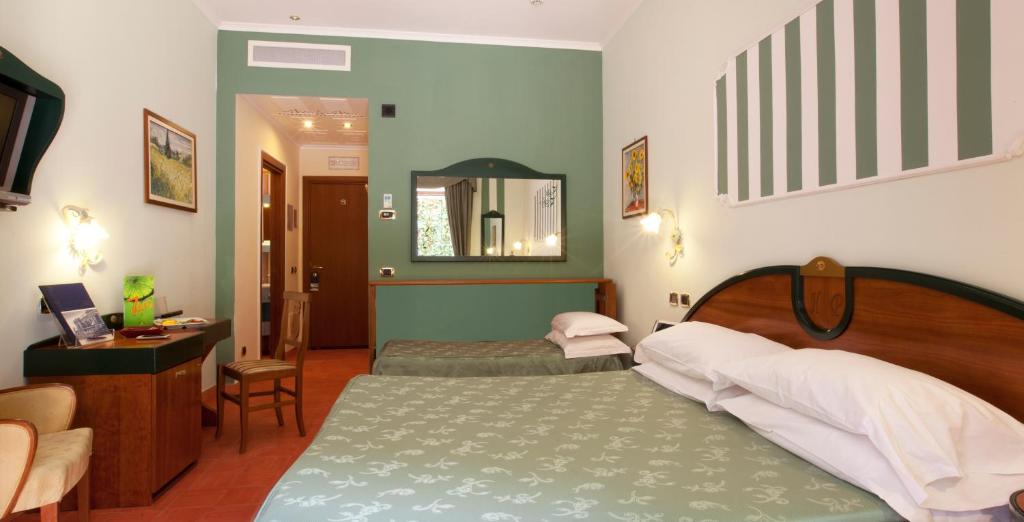Postel nebo postele na pokoji v ubytování Hotel Prestige