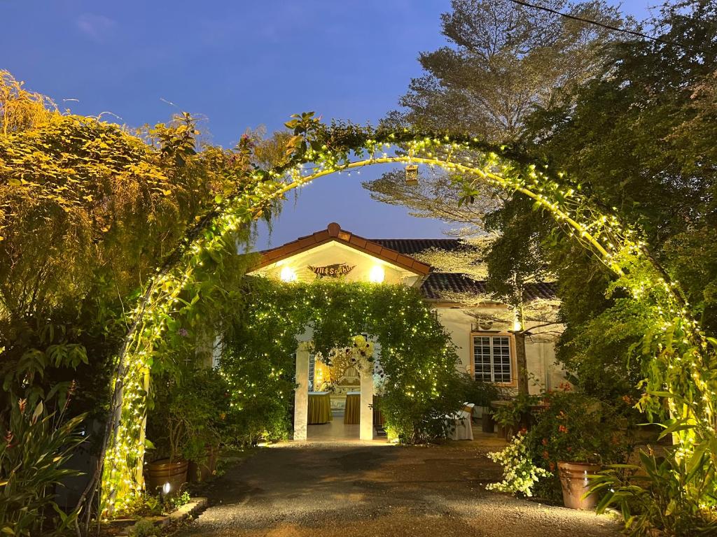an archway in front of a house with lights at Homestay VillaSolihin Sungai Buloh in Sungai Buluh