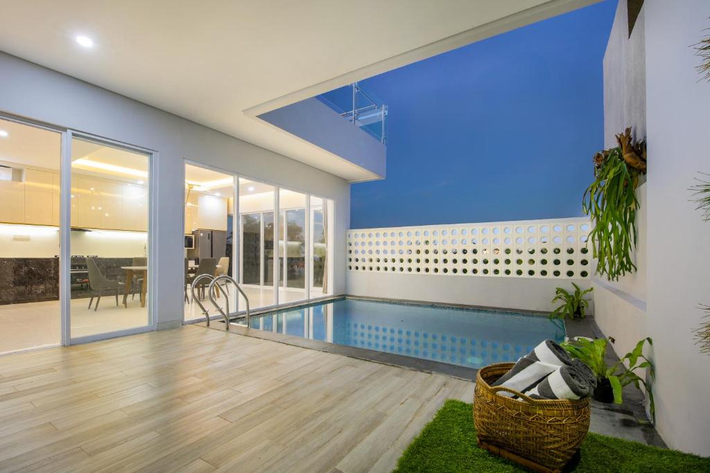 a swimming pool in the middle of a house at The Hill Ocean View Villa - Jimbaran Bali in Uluwatu