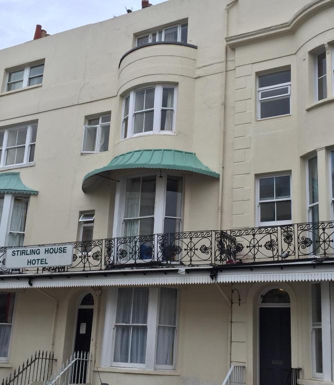 a building with a balcony on the side of it at Sterling Lodge Hotel in Eastbourne